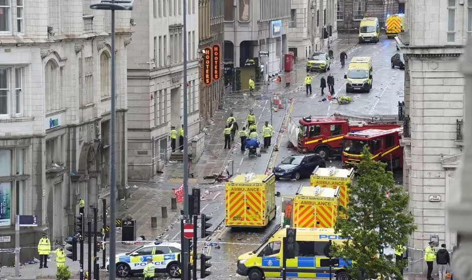 Emergency services attend crime scene where car slammed into crowd in Liverpool