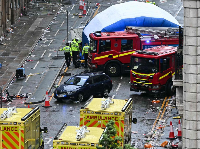 The car that ploughed into the crowd, surrounded by emergency service vehicles Liverpool